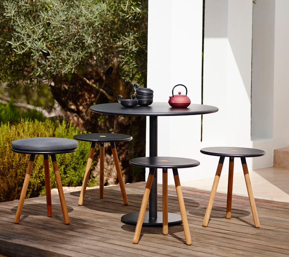 Area dining table in an outdoor terrace setting