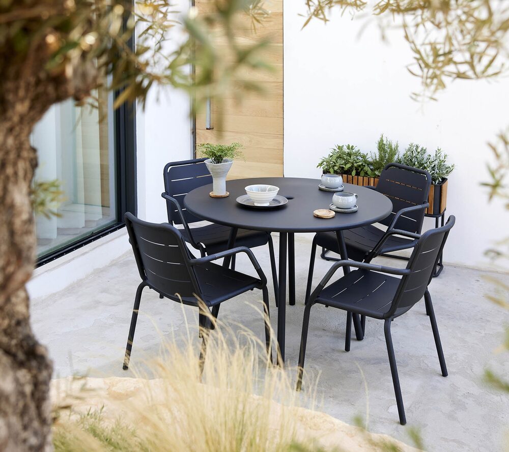 Area table with Cane-line Copenhagen armchairs