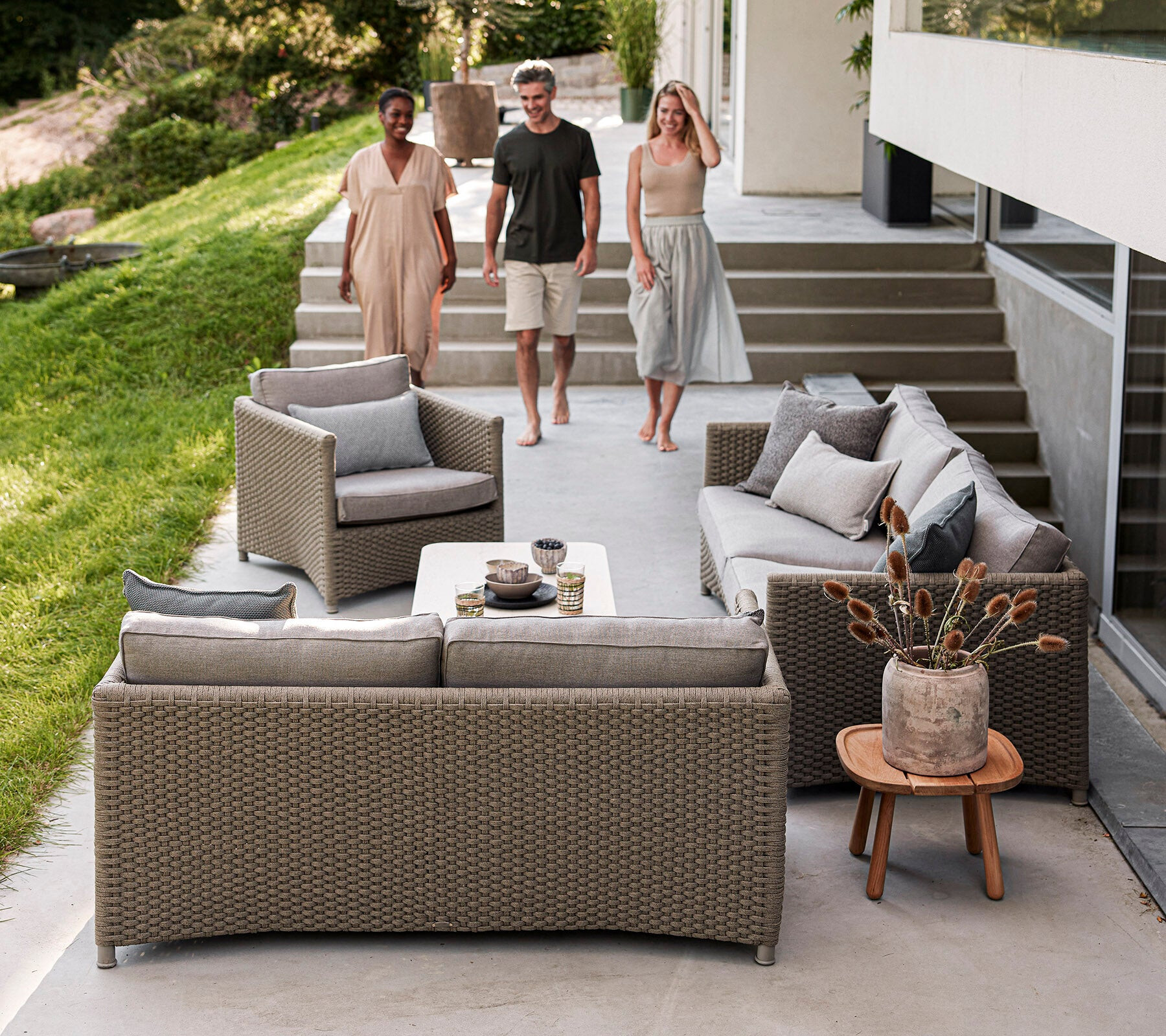 Cane-line Diamond sofas in graphite rope weave in a garden