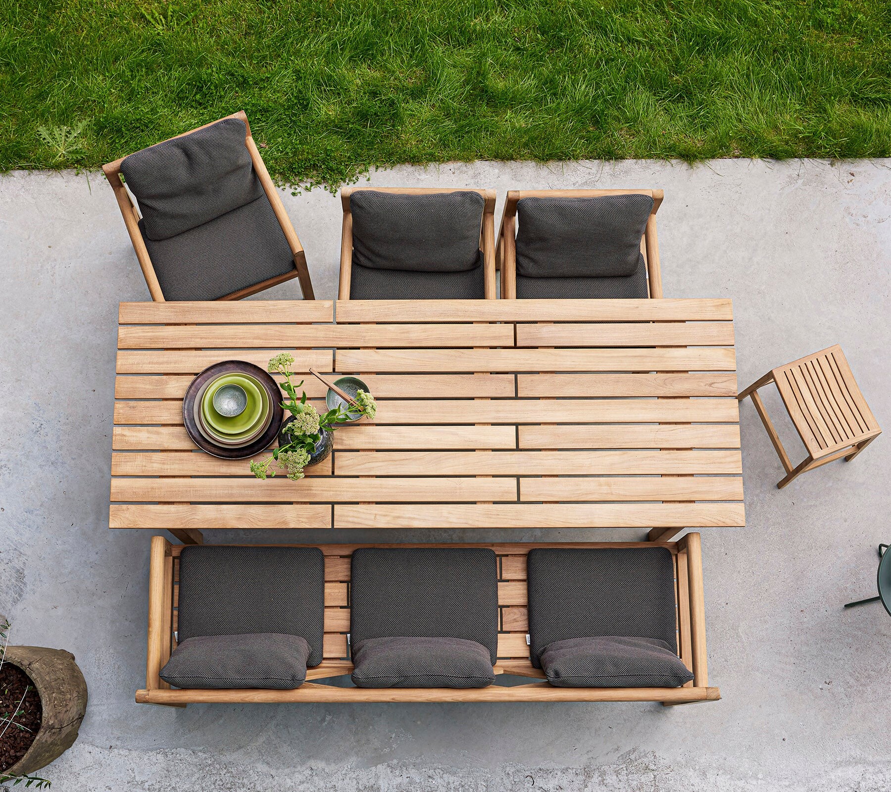 Cane-line Grace teak dining set viewed from above on a lawn