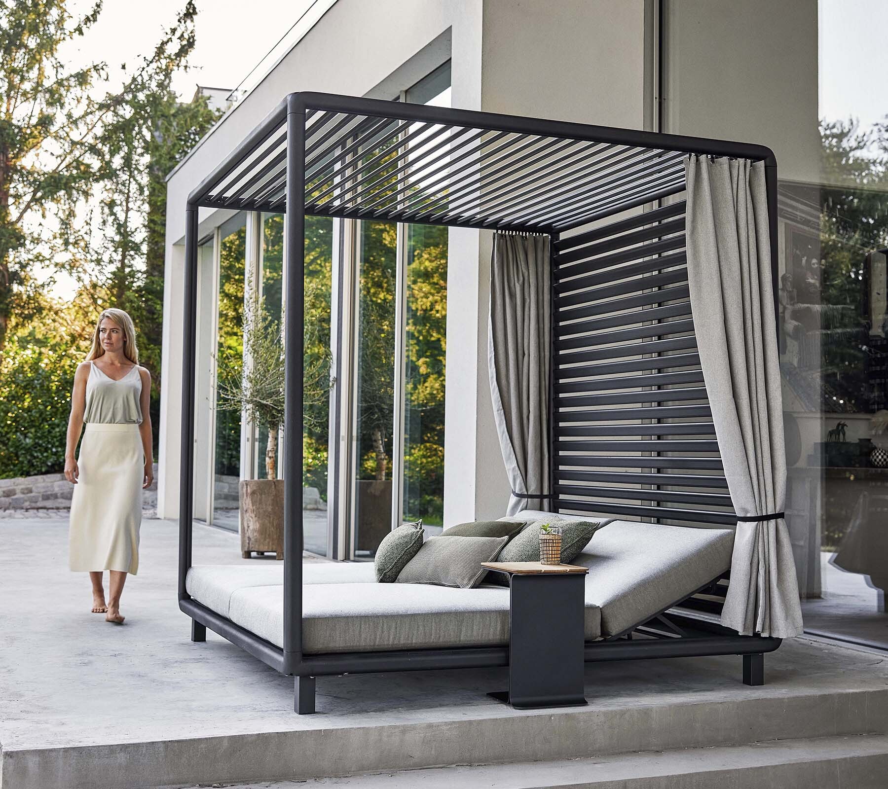 Cane-line Laze cabana with open slatted roof in daylight