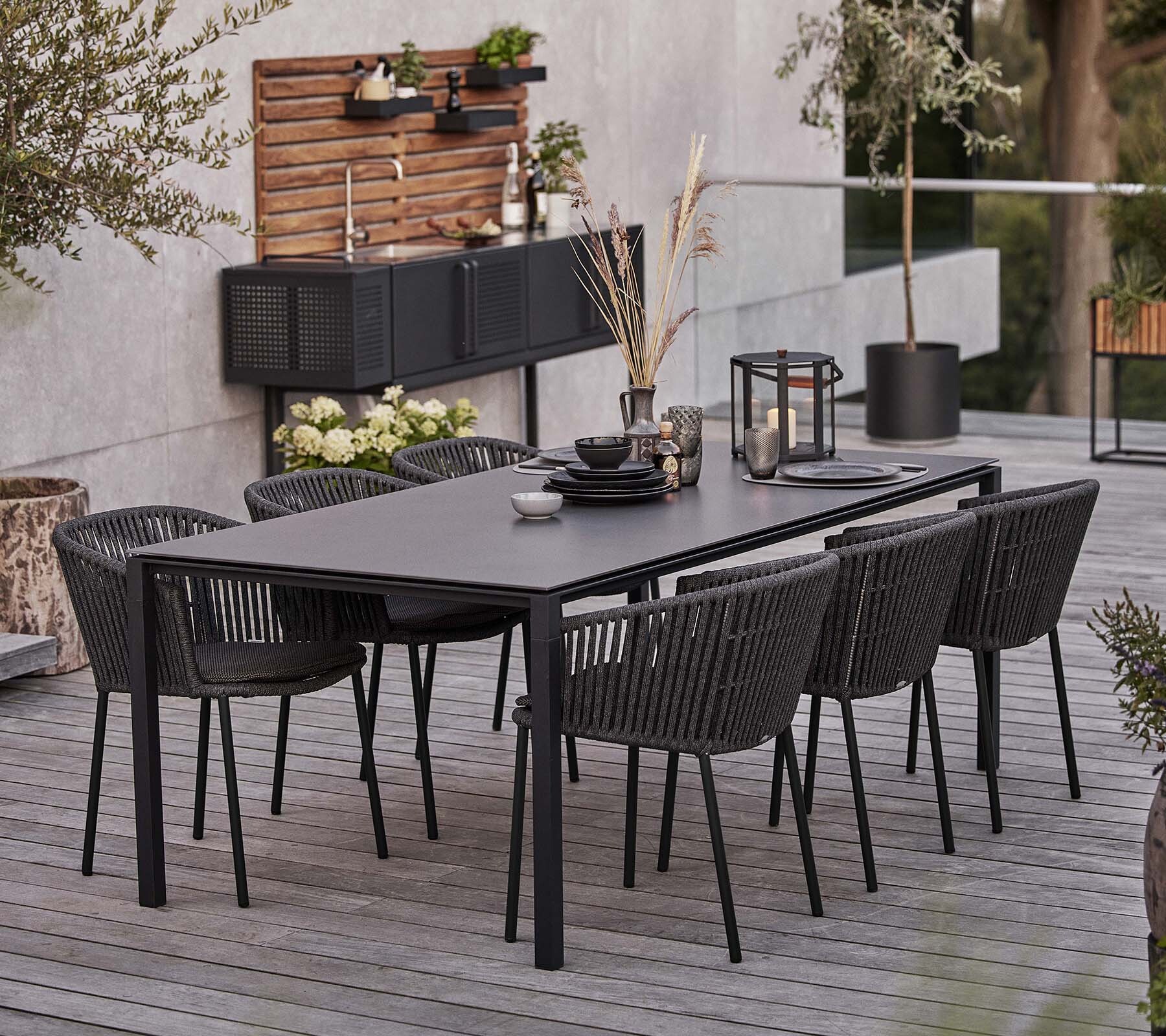 Cane-line Moments outdoor dining set on a terrace
