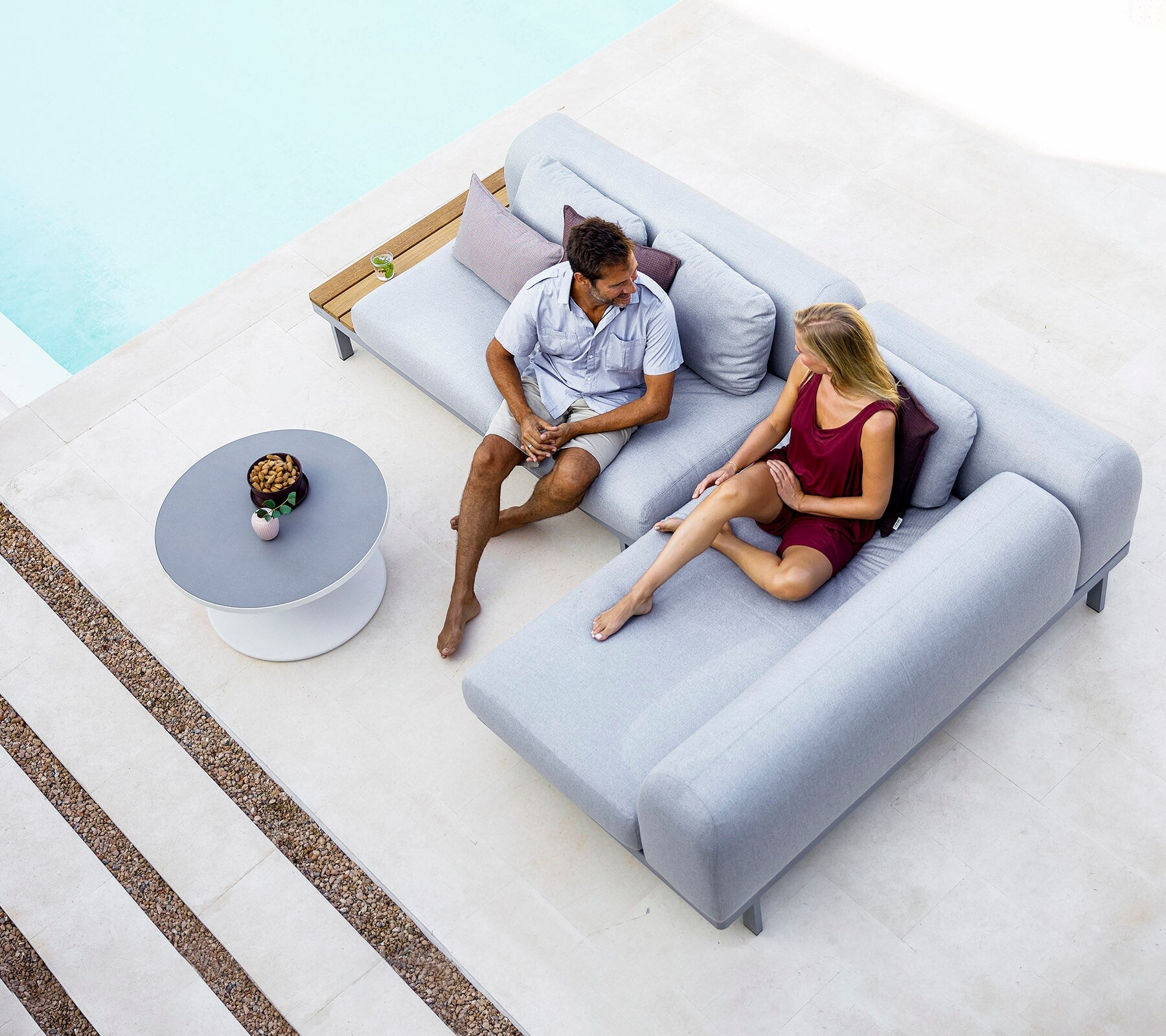 Cane-line Space modular sofa with a couple, viewed from above