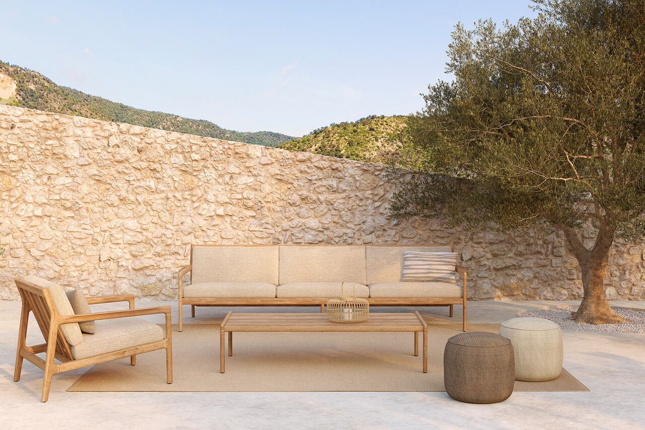 Jack outdoor sofa with Donut poufs and Nomad rug