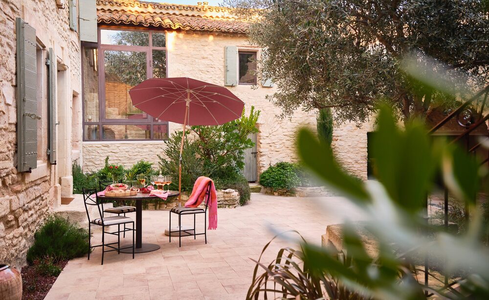 Alexo parasols over an outdoor dining terrace