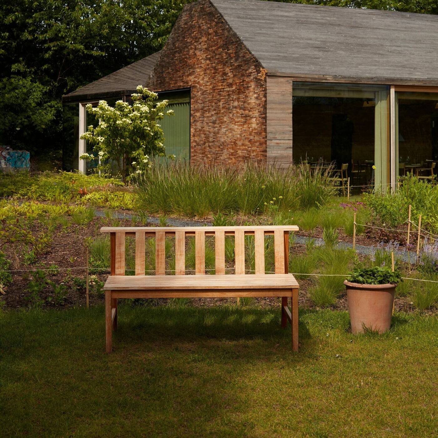 Plank teak bench in an outdoor setting